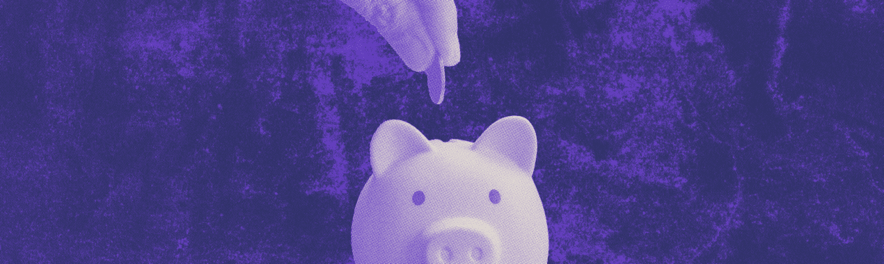 dropping-change-into-piggy-bank-image